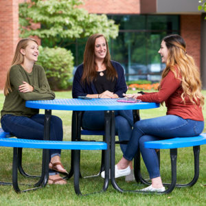 Teradyne employees conversing at outdoor table